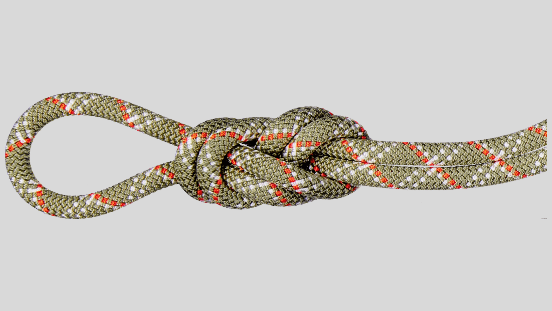 climbing rope tied with secure knot forming loop for anchoring and safety use on a clean background