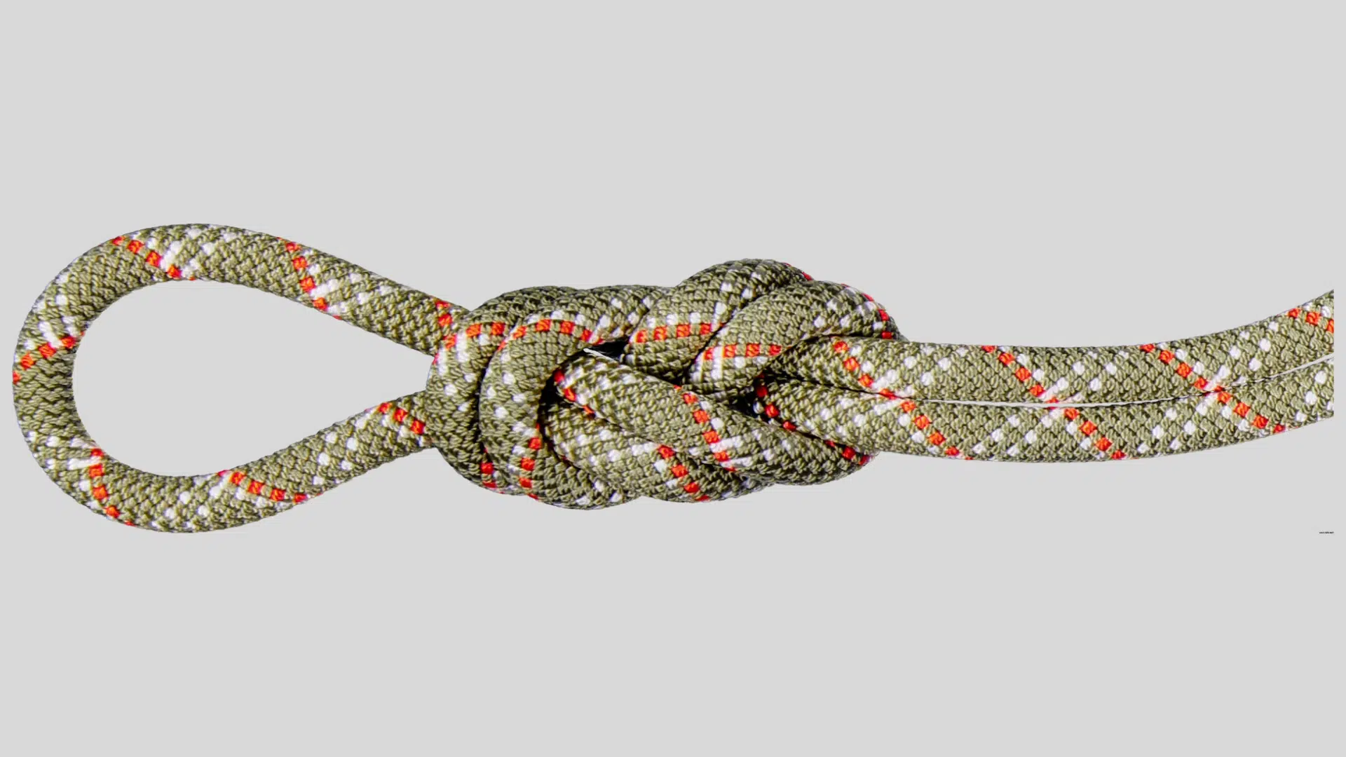climbing rope tied with secure knot forming loop for anchoring and safety use on a clean background