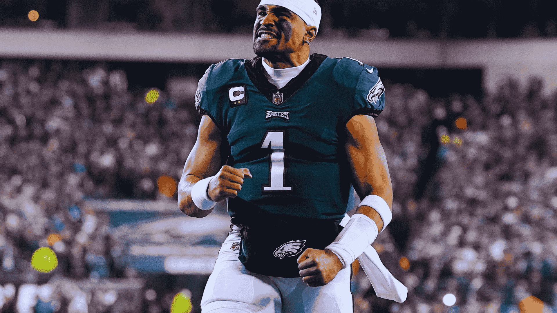 eagles quarterback jalen hurts in number 1 celebrates with clenched fists as fans cheer