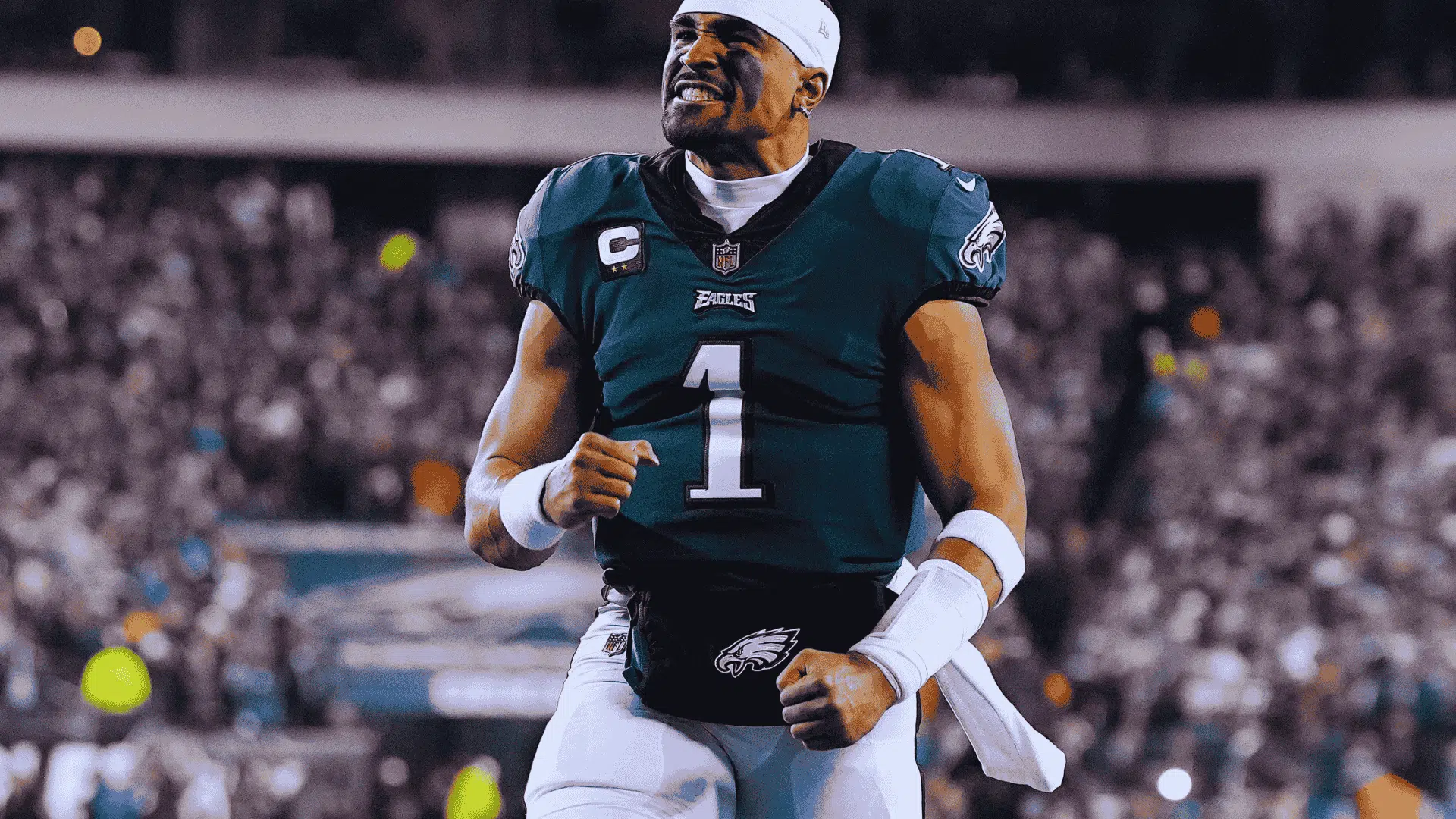 eagles quarterback jalen hurts in number 1 celebrates with clenched fists as fans cheer