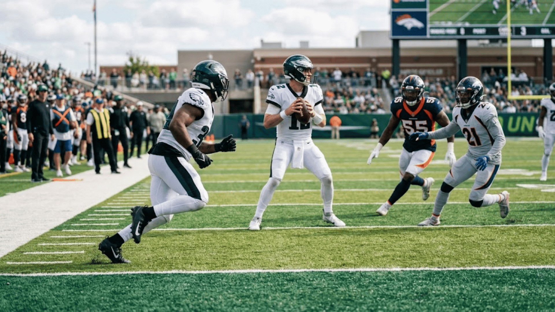 football running back turning upfield during a wheel route play near the sideline in an nfl game