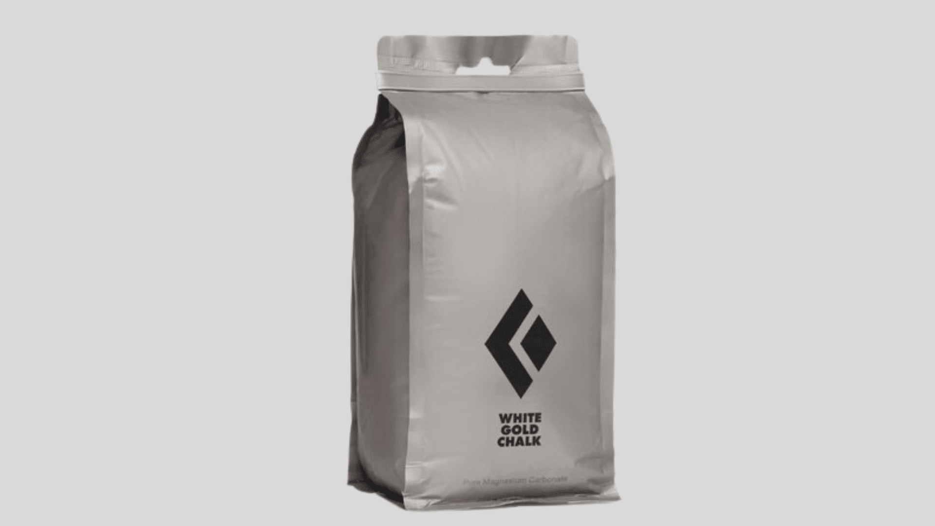 gray bag of climbing chalk for hand grip support with resealable top on a clean background