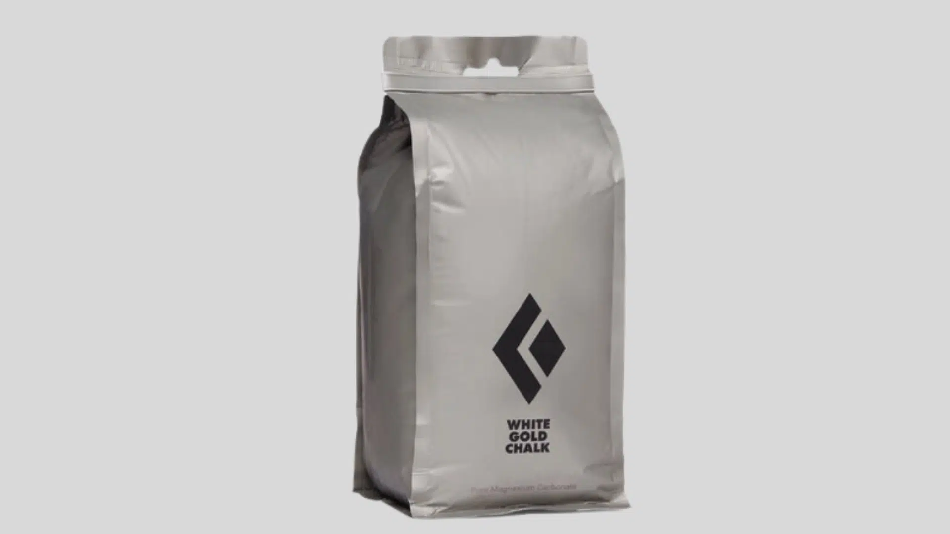 gray bag of climbing chalk for hand grip support with resealable top on a clean background
