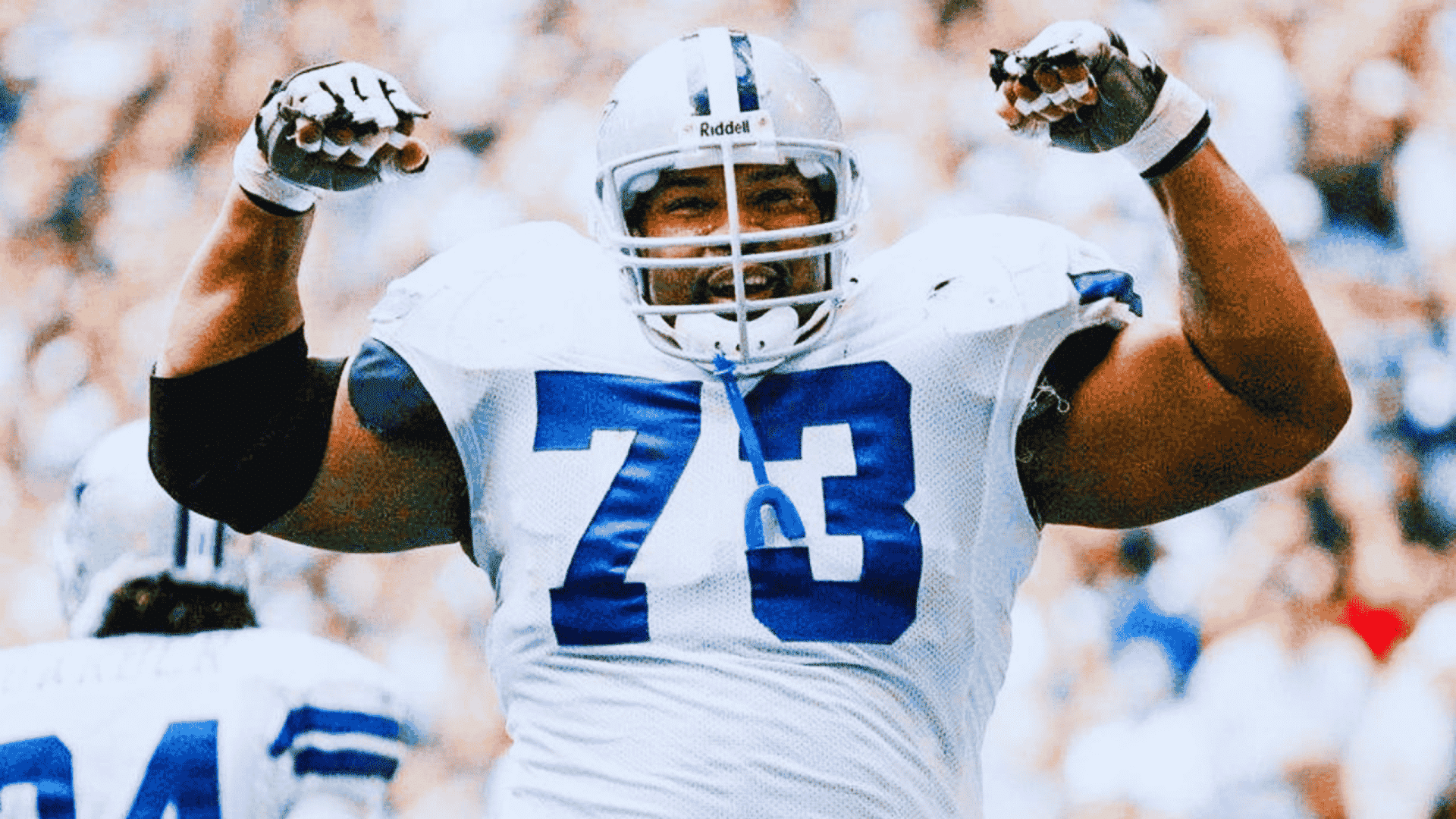 lary allen is an offensive lineman wearing number 73 flexes his arms in celebration on the field
