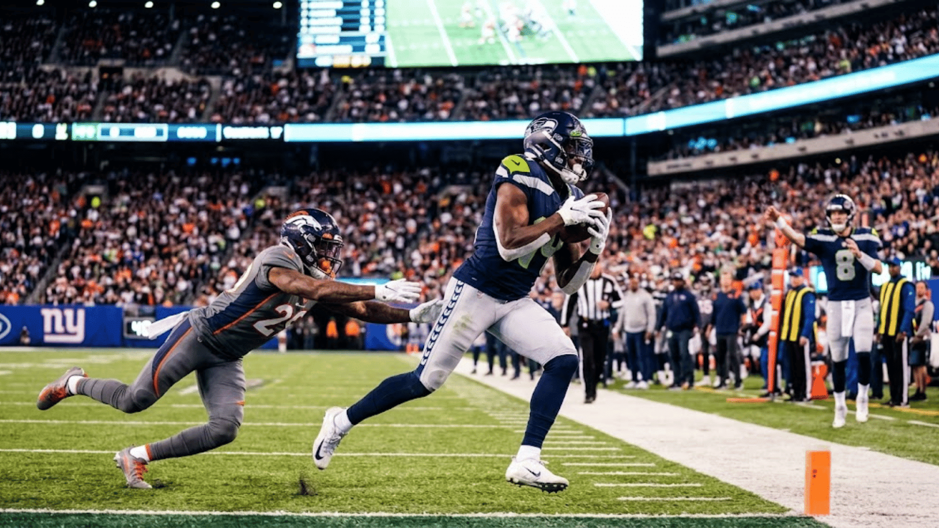 quarterback throwing a deep sideline pass during a football wheel route against man coverage