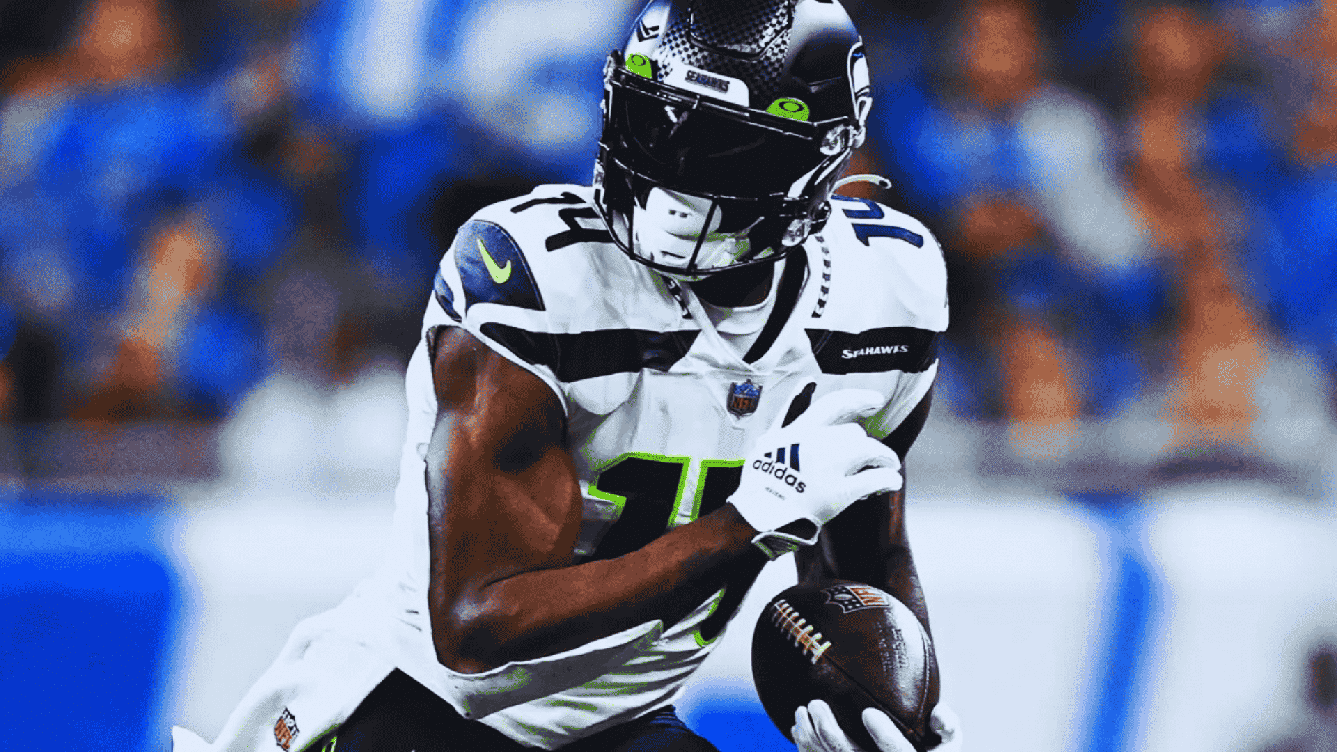 seahawks dk metcalf in number 14 runs forward holding football tightly during intense play