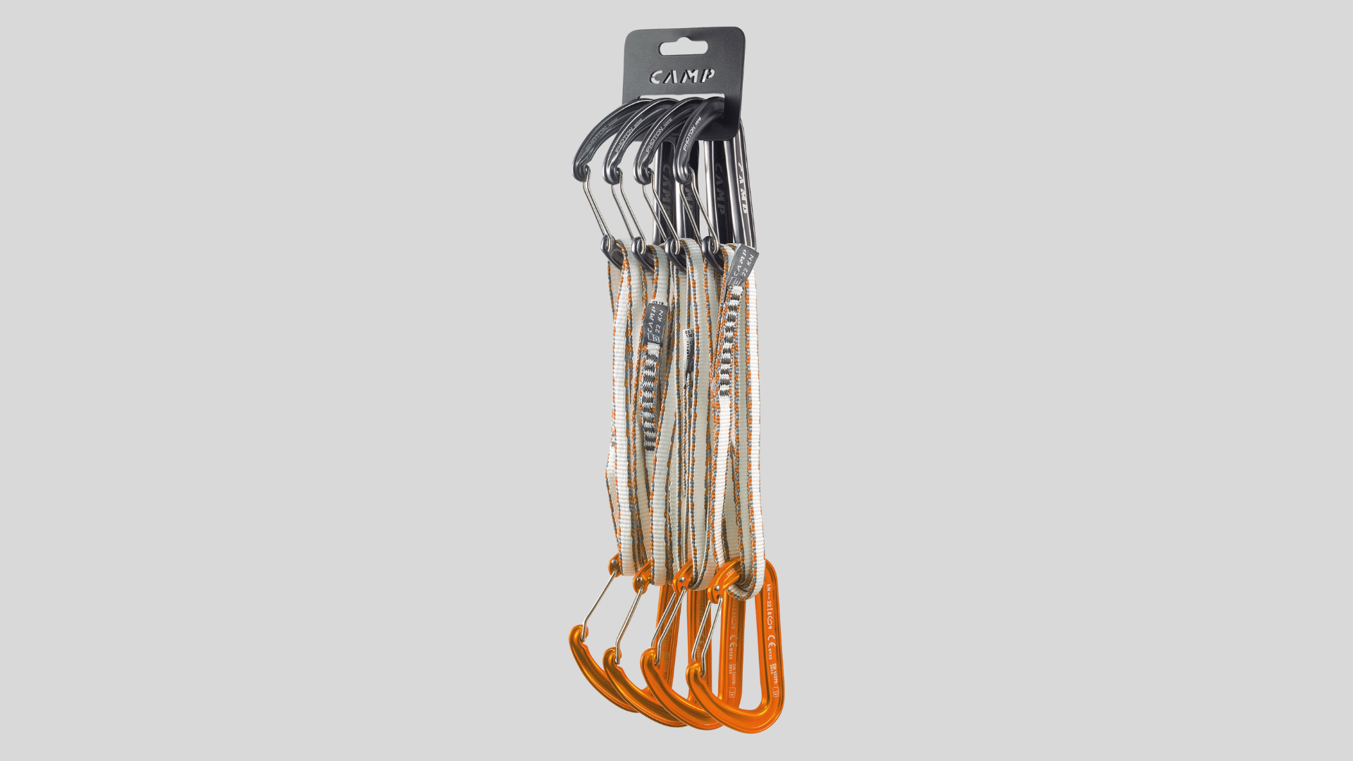 set of climbing quickdraws with carabiners and sewn slings attached for sport climbing use on a clean background