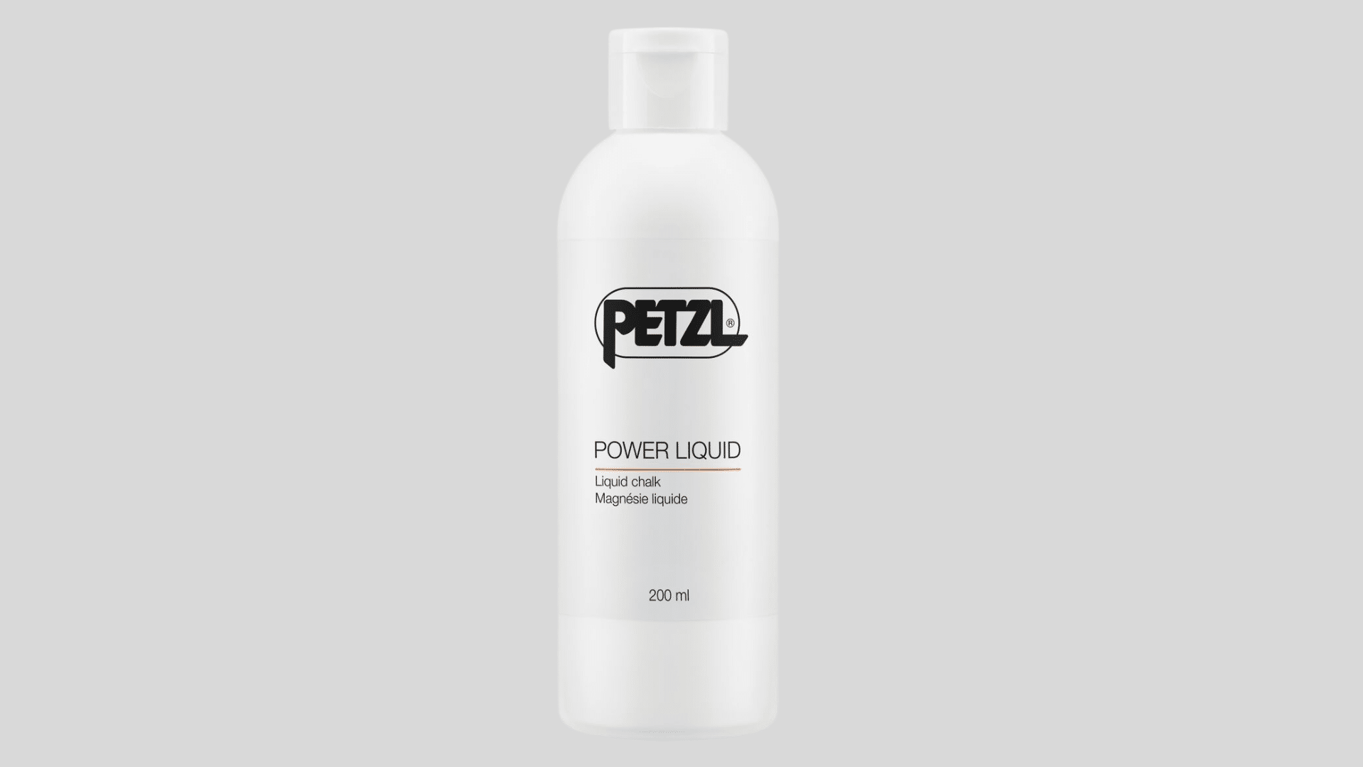 white bottle of liquid chalk for climbing grip with flip cap design on a clean background