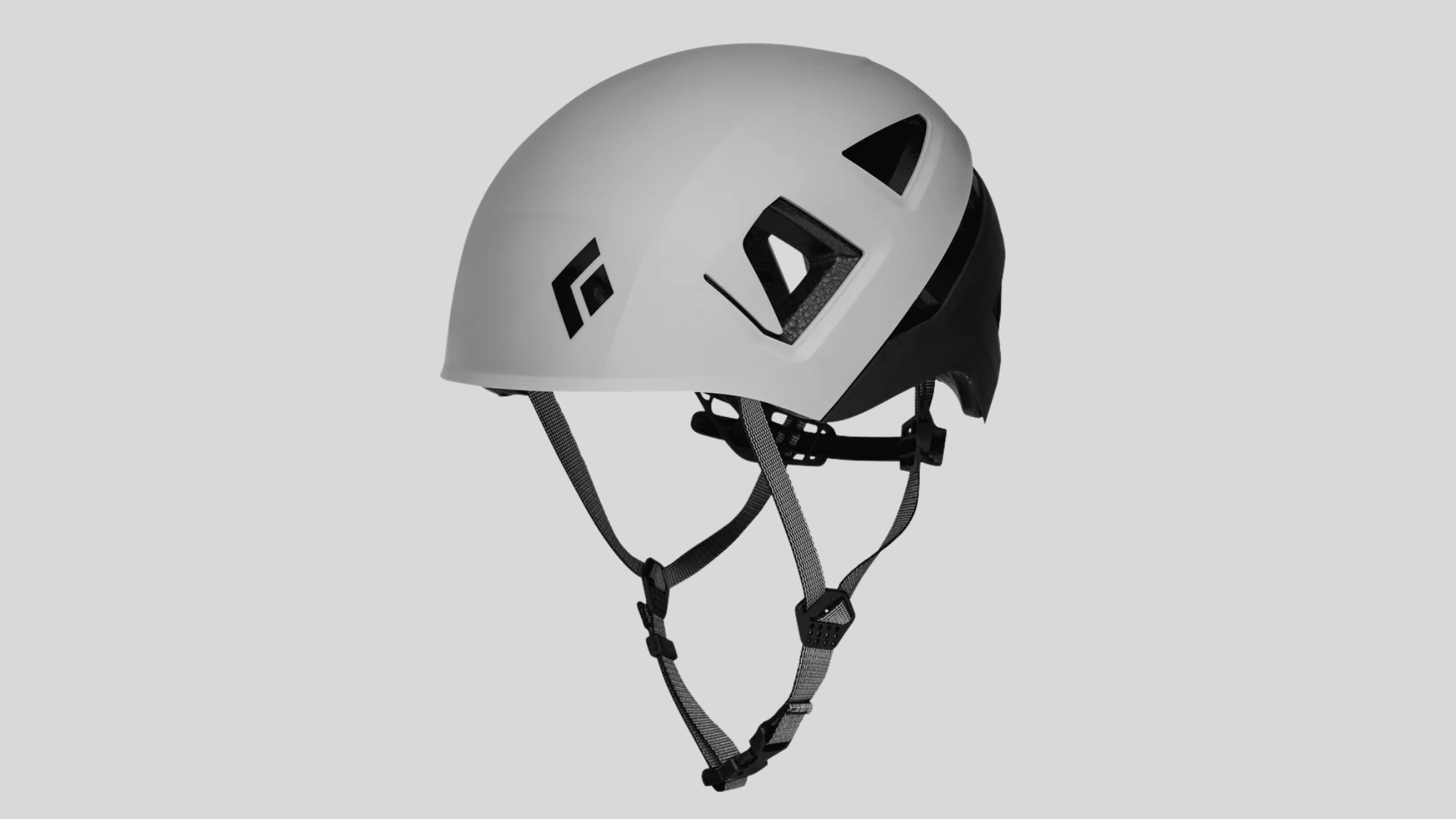 white climbing helmet with black straps and ventilation openings on a clean background