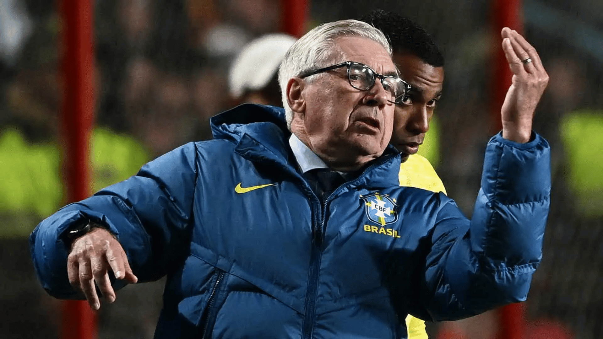carlo ancelotti wearing a blue brazil national team jacket during a soccer match
