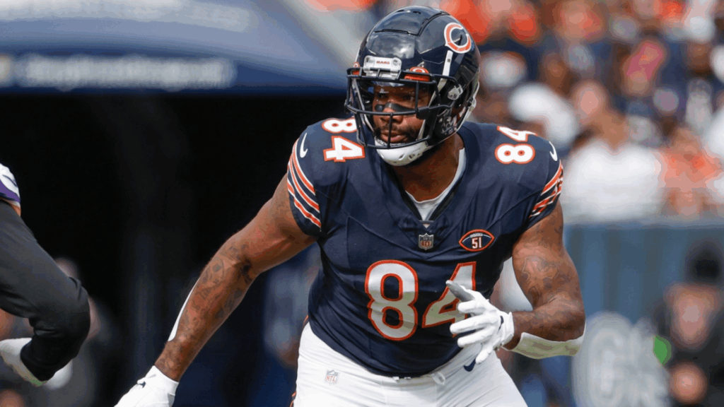 chicago bears player wearing number 84 runs during a football game while focusing on an opposing defender