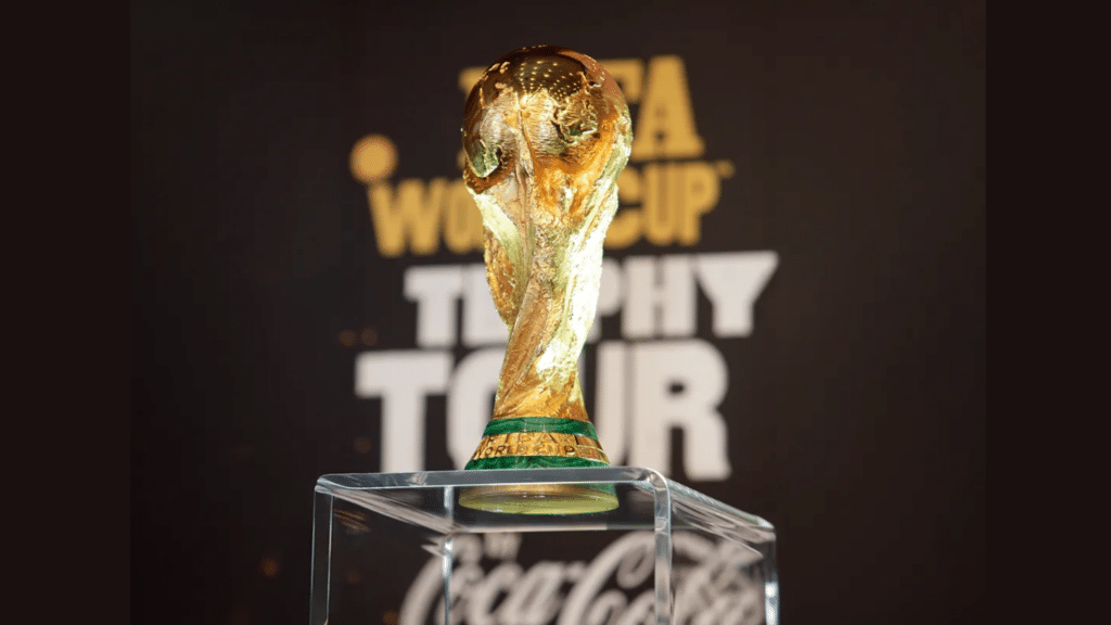 gold fifa world cup trophy displayed on a clear pedestal during the fifa world cup trophy tour