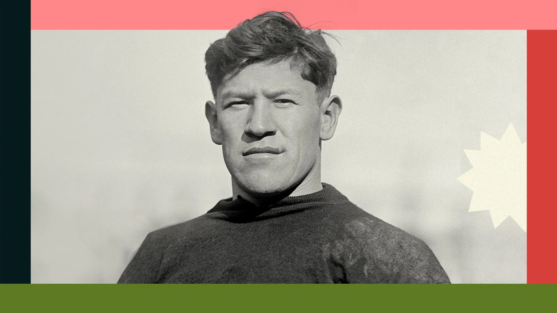 Jim Thorpe portrait in a historic black and white photograph wearing an athletic sweater and looking toward the camera