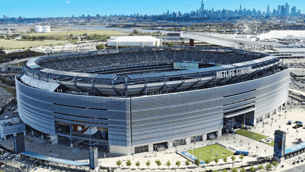 outside view of the metlife stadium at the edge of new york with fans gathering outside of the stadium