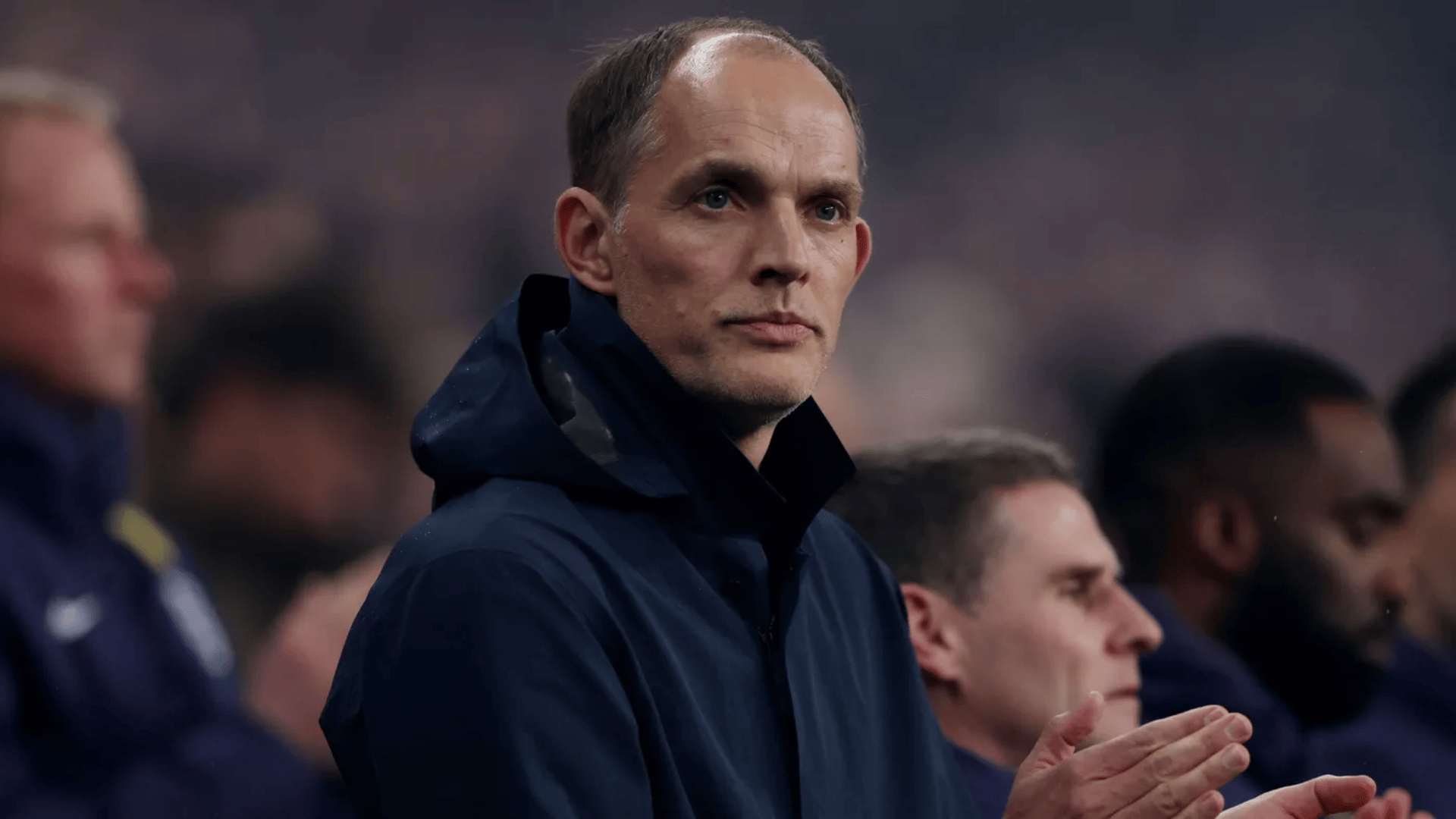 soccer manager thomas tuchel watching his team play from the sidelines of the pitch