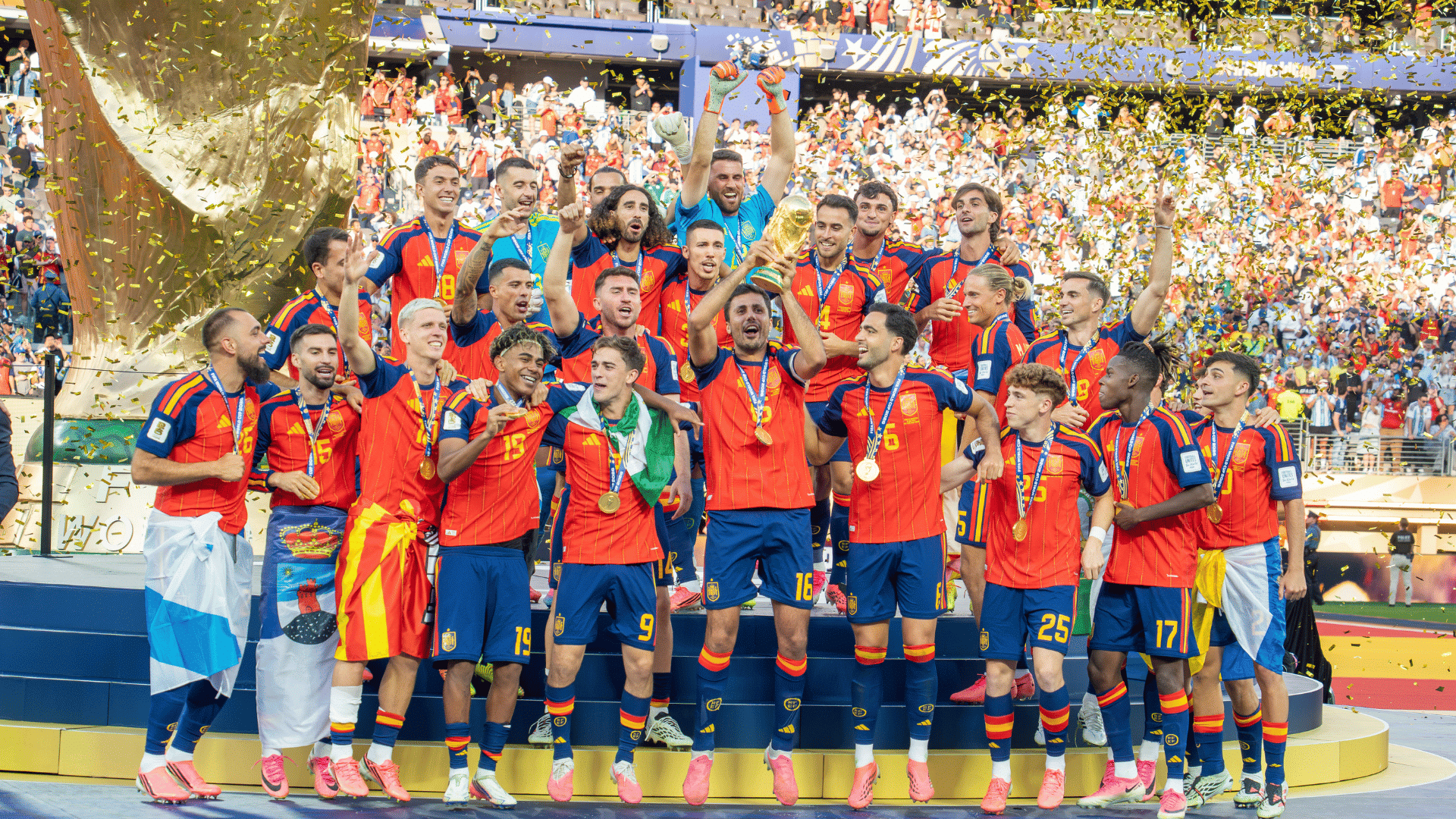 spain football team celebrates while lifting the world cup trophy as gold confetti falls in a packed stadium