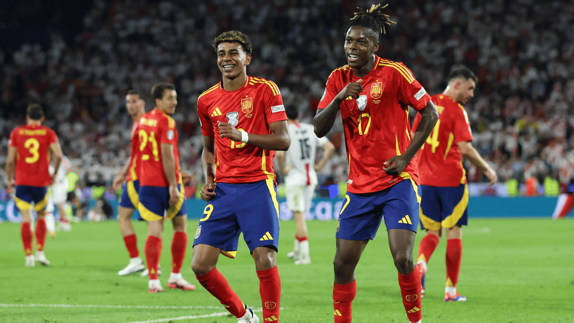 spanish soccer players lamine yamal and nico williams celebrating a goal together