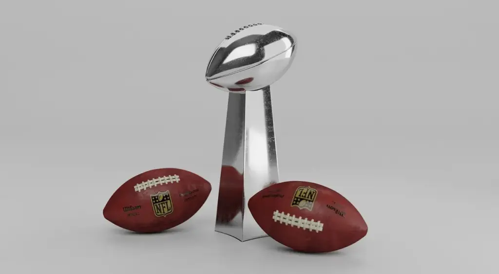 NFL Vince Lombardi Trophy with two brown footballs on gray background