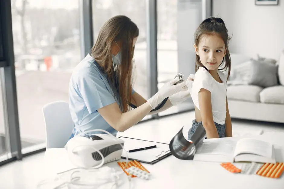Healthcare worker examining young girl with stethoscope in bright clinic setting
