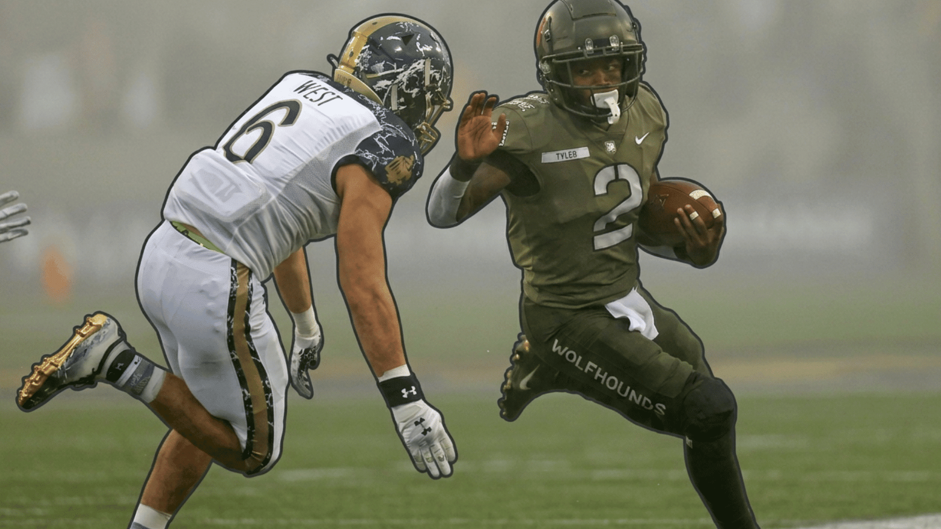 a football player in a dark uniform carries the ball while avoiding a defender during a foggy game on the field