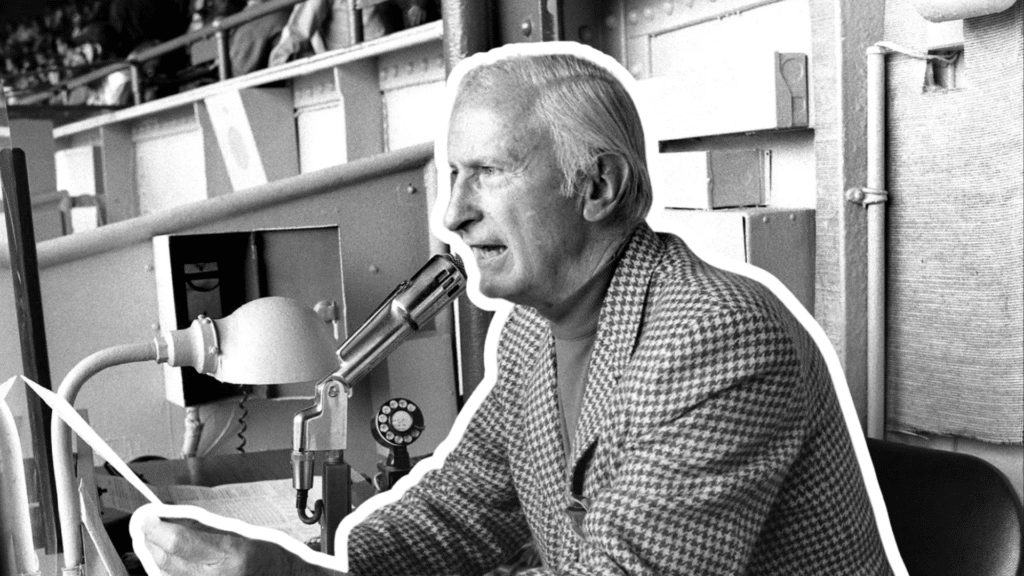 bob sheppard announcing a new york yankees game from the press box while speaking into a microphone