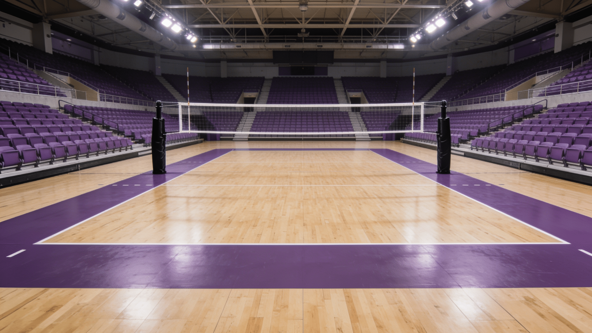 indoor volleyball court with wooden floor and central net surrounded by purple arena seating