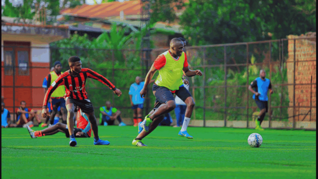 soccer players sprint across the field while competing for the ball during a fast paced match on green turf