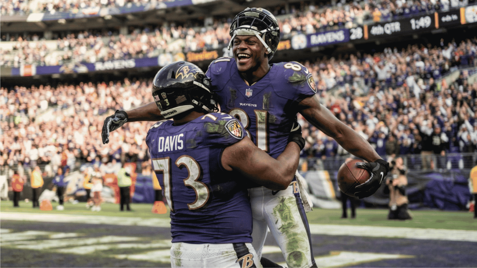 two ravens players celebrate in the end zone with a hug while one holds the football before cheering fans (2)