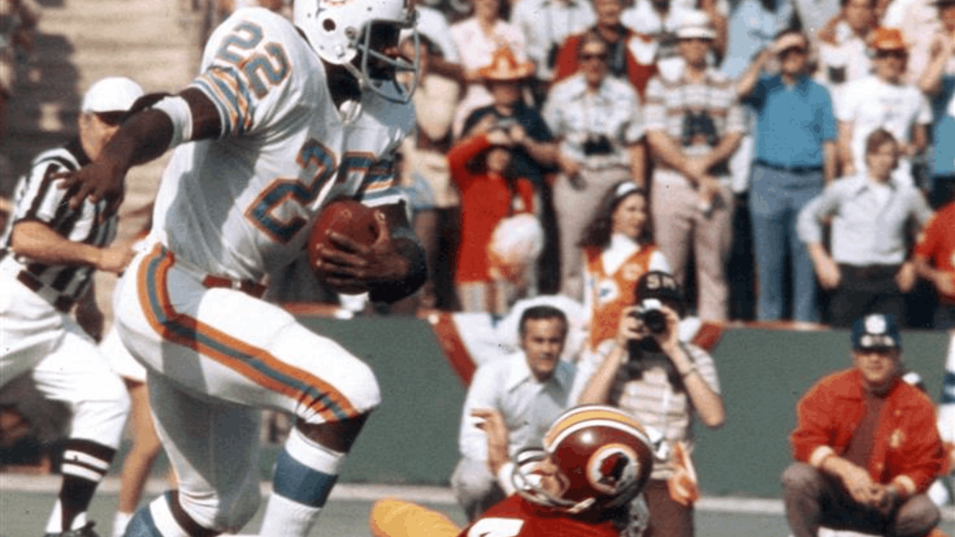 1972 miami dolphins player carrying the football during a game against the washington redskins