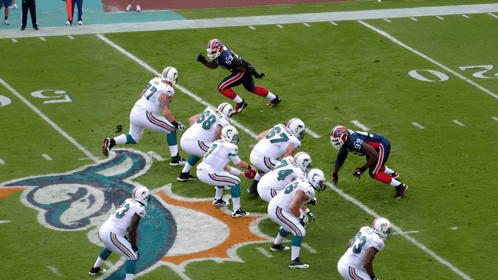 a gap b gap c gap football formation showing players lined up on field during an active game play