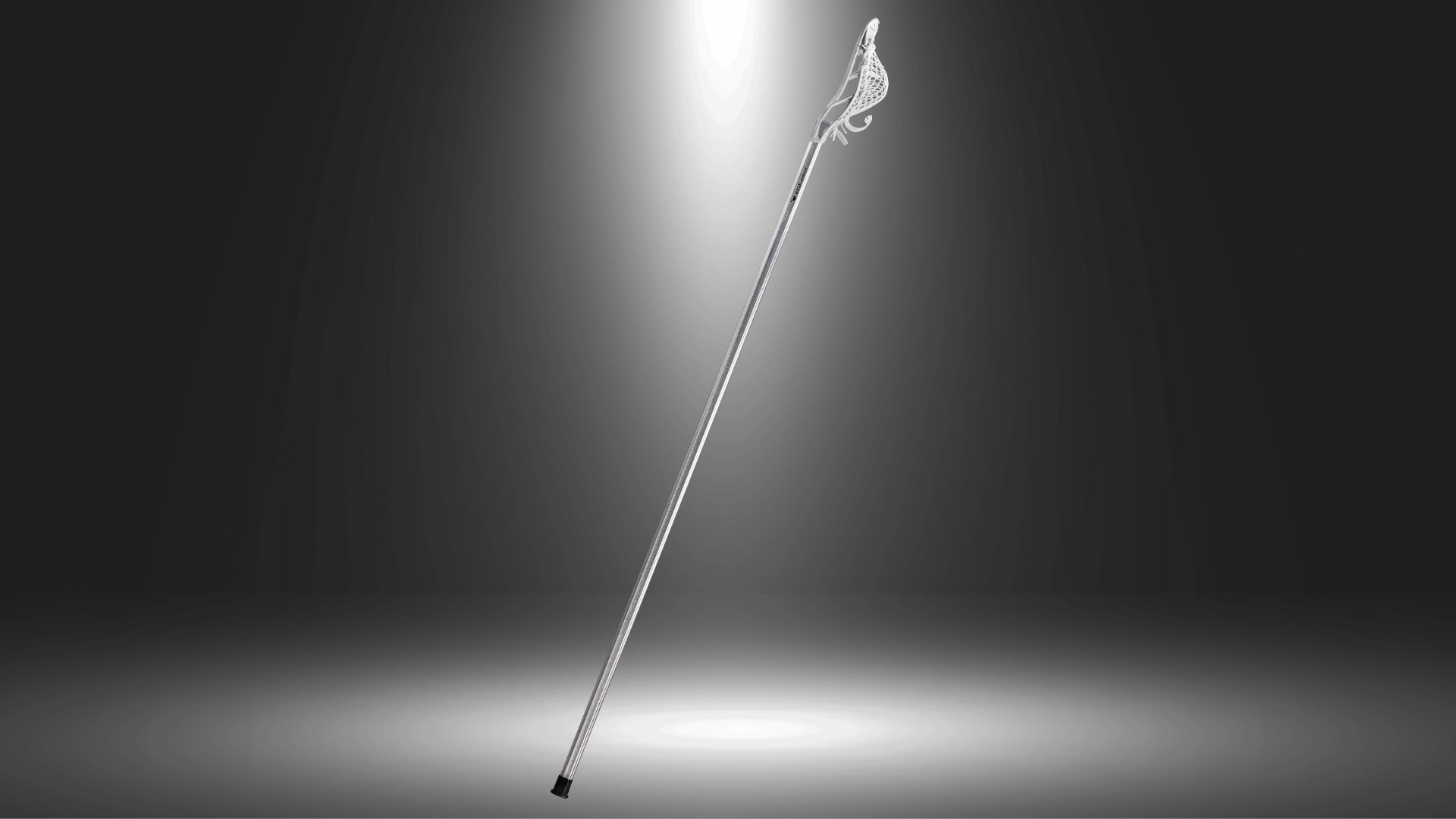 ecd bravo 1 elite setup defense lacrosse stick with long shaft displayed against a dark background