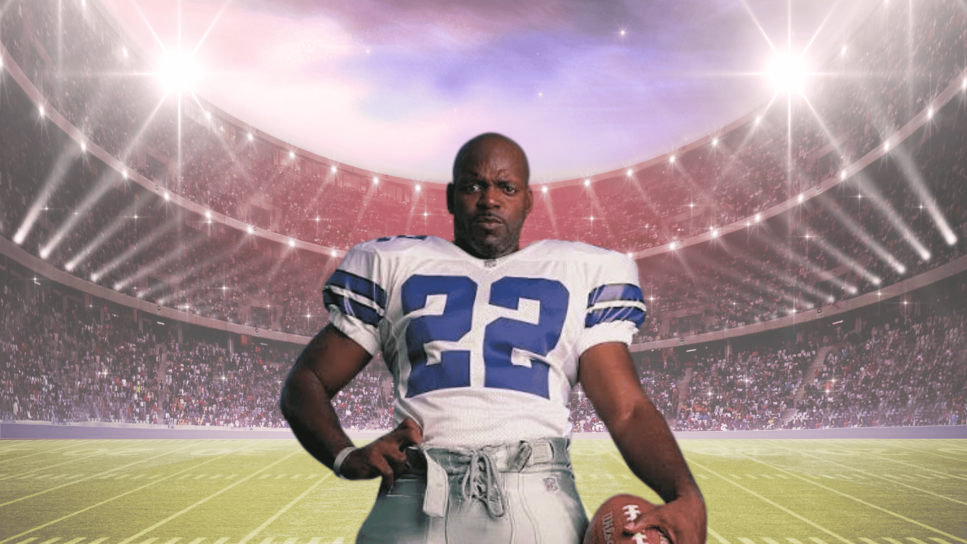 football player in a white and blue uniform holding a football while standing