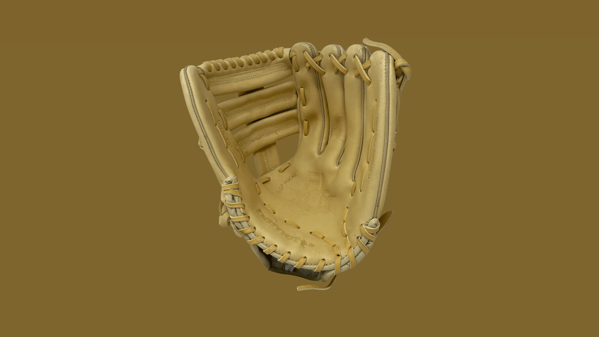 tan leather baseball glove with an open pocket and woven webbing displayed against a solid brown background showing the catching side