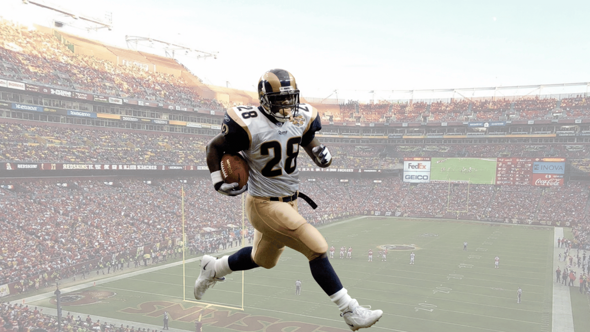football player in a white and gold uniform running across the field while carrying a football under his arm