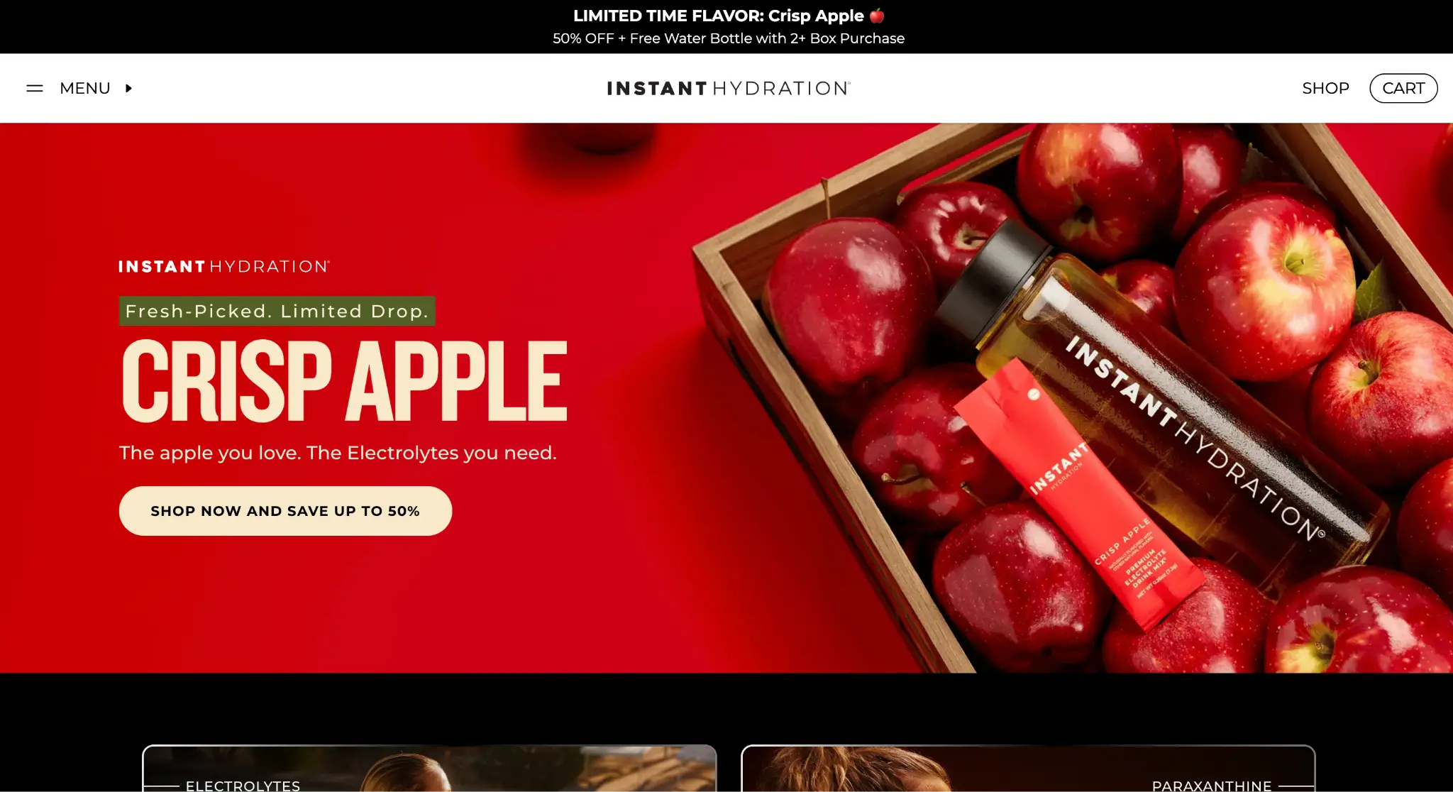 Box of red apples and Instant Hydration bottle on a vivid red background